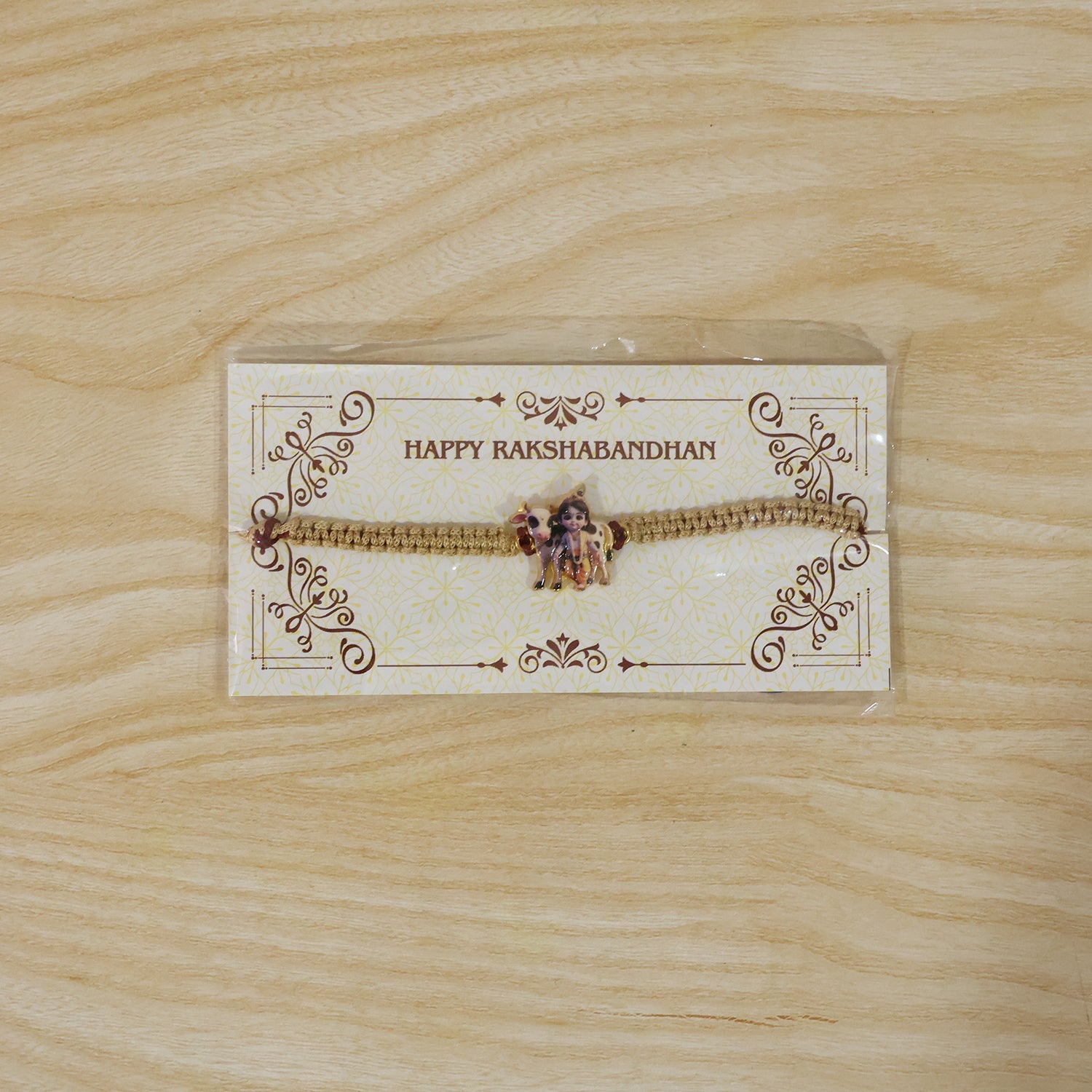 Elegant Krishna Cow traditional rakhi with neat finishing