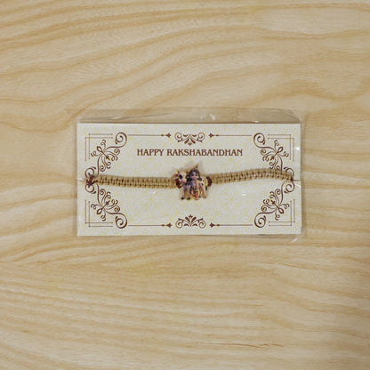 Elegant Krishna Cow traditional rakhi with neat finishing