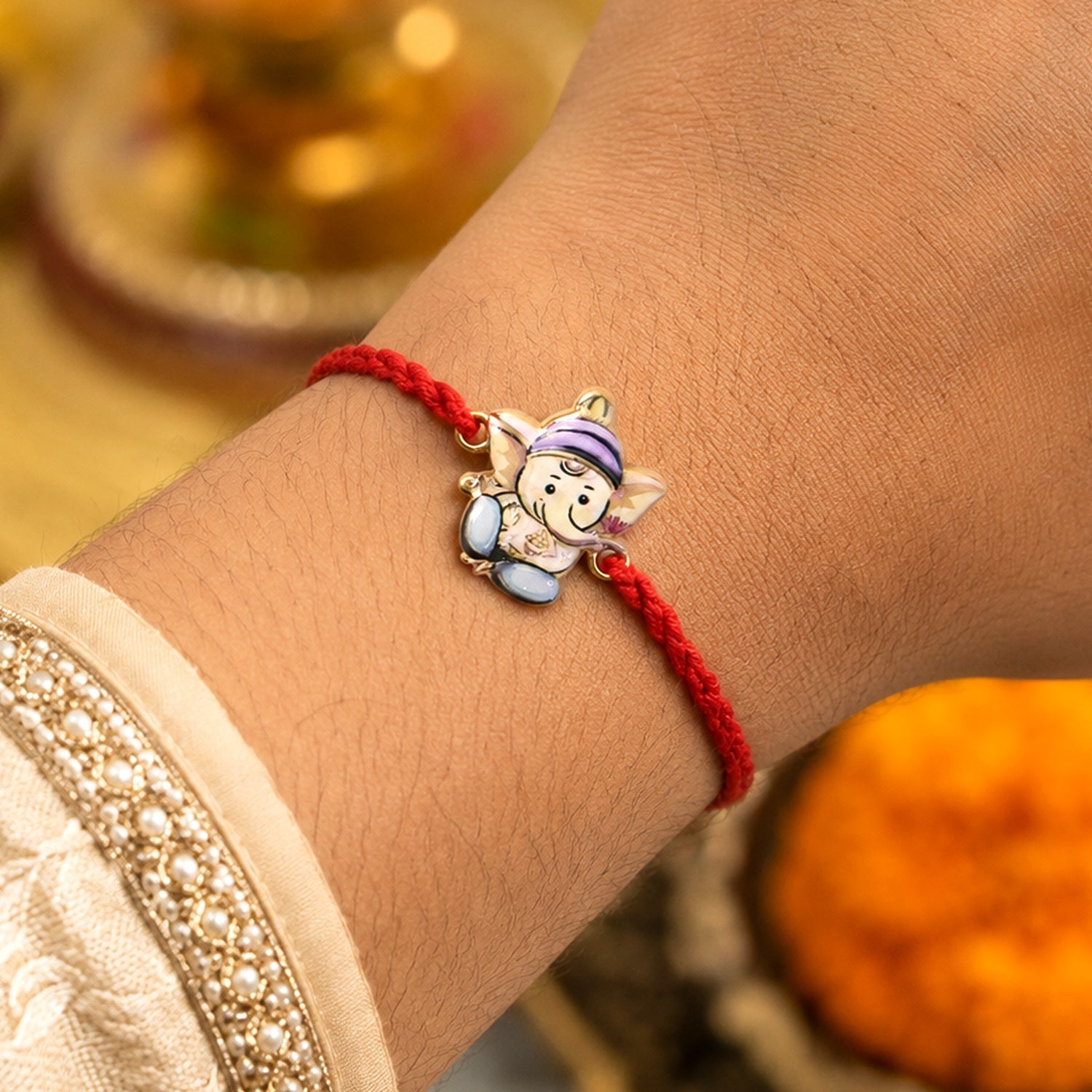 Close-up of Ganesh motif on rakhi