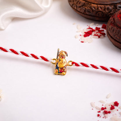 Side view of Hanuman Ji designer rakhi with orange and red thread