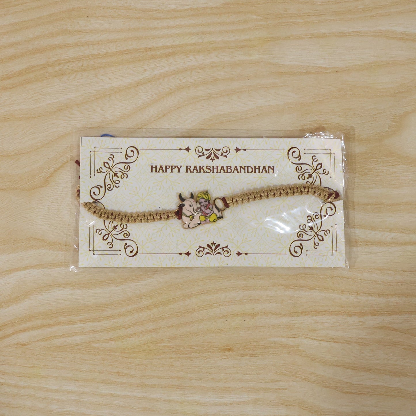 Top view of Krishna with Cow Fancy Dori Rakhi