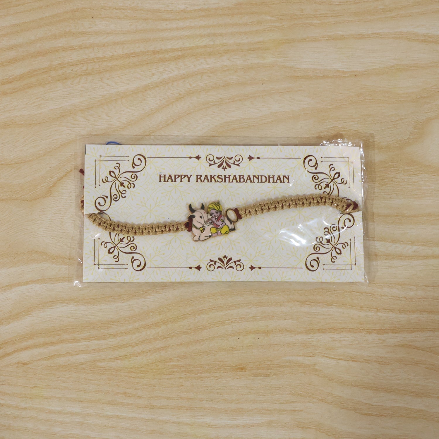 Top view of Krishna with Cow Fancy Dori Rakhi