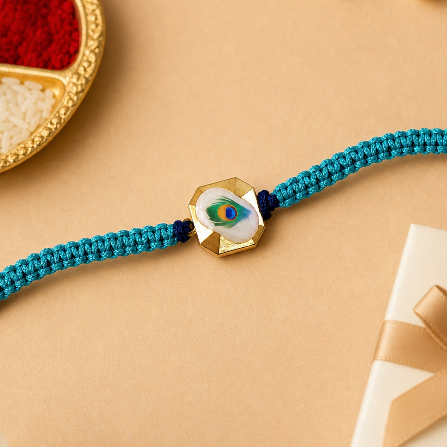 Side View of Peacock Feather Fancy Dori Rakhi