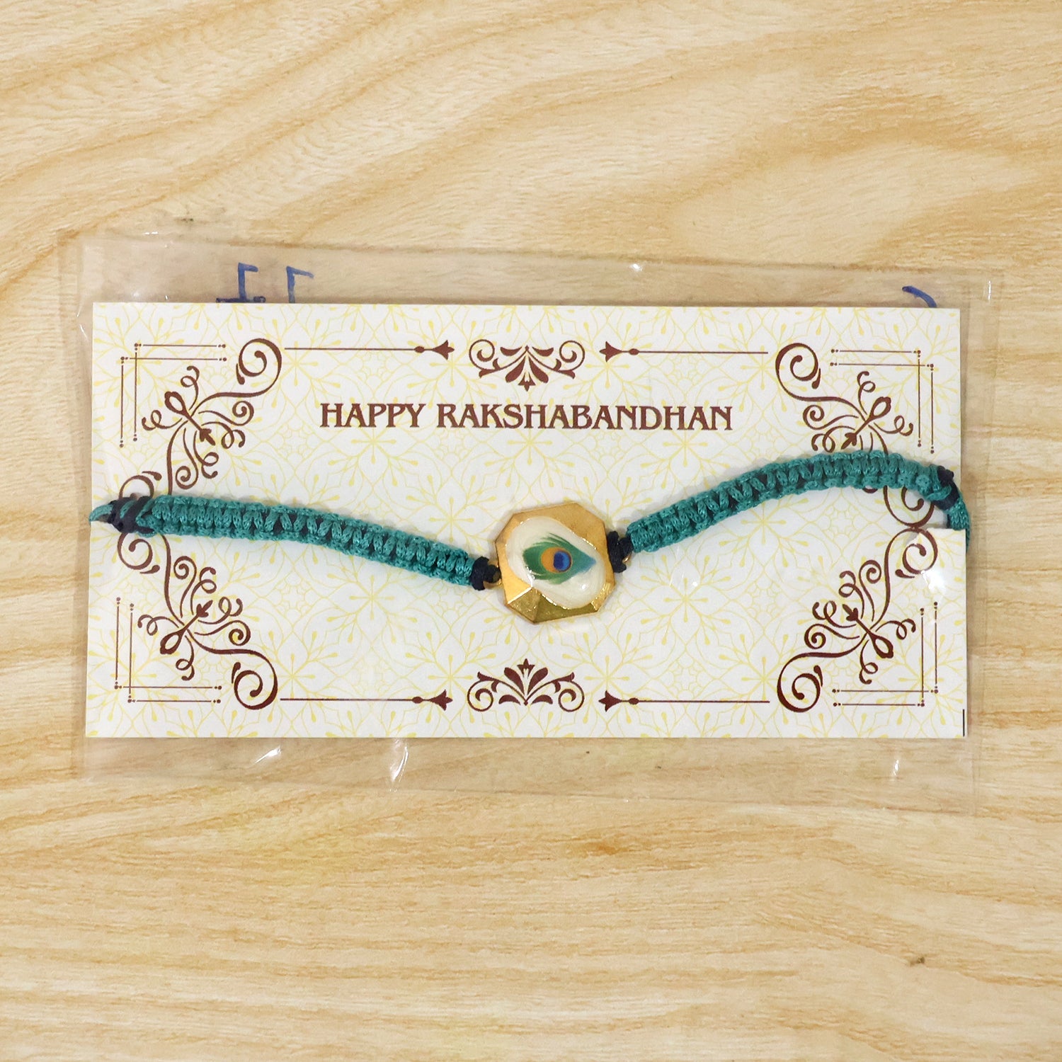 Detailed View of Peacock Feather Fancy Dori Rakhi Design