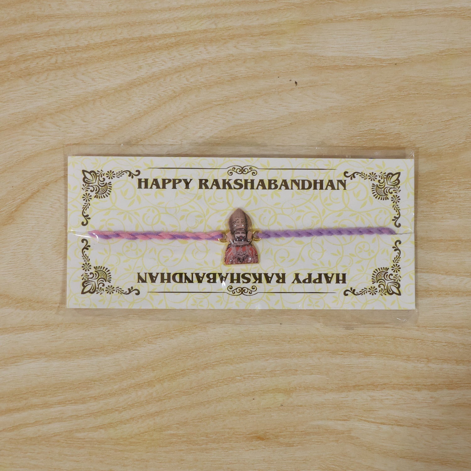 Religious Fancy Dori Rakhi displayed on white background