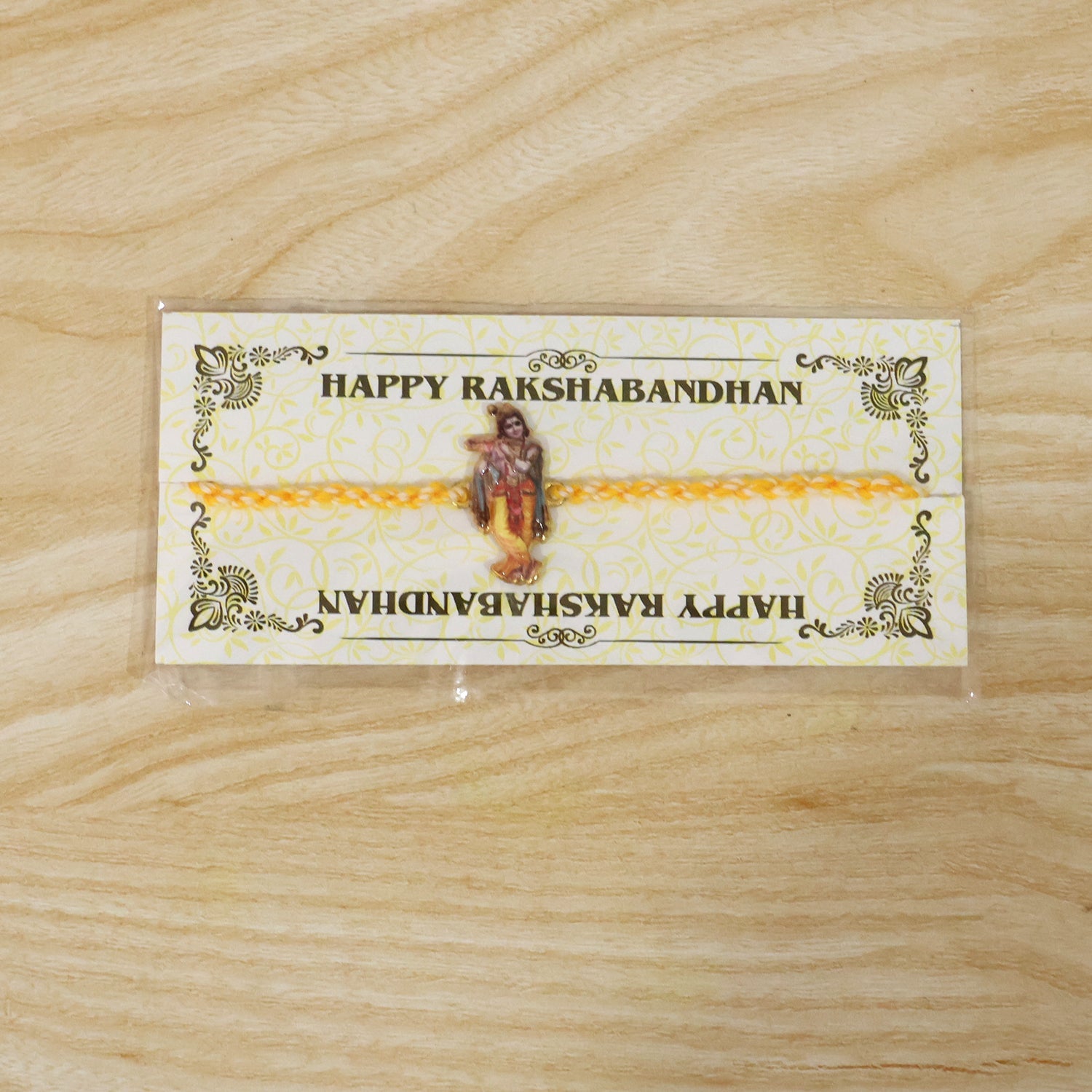 Elegant Krishna Flute Charm Fancy Dori Rakhi close-up