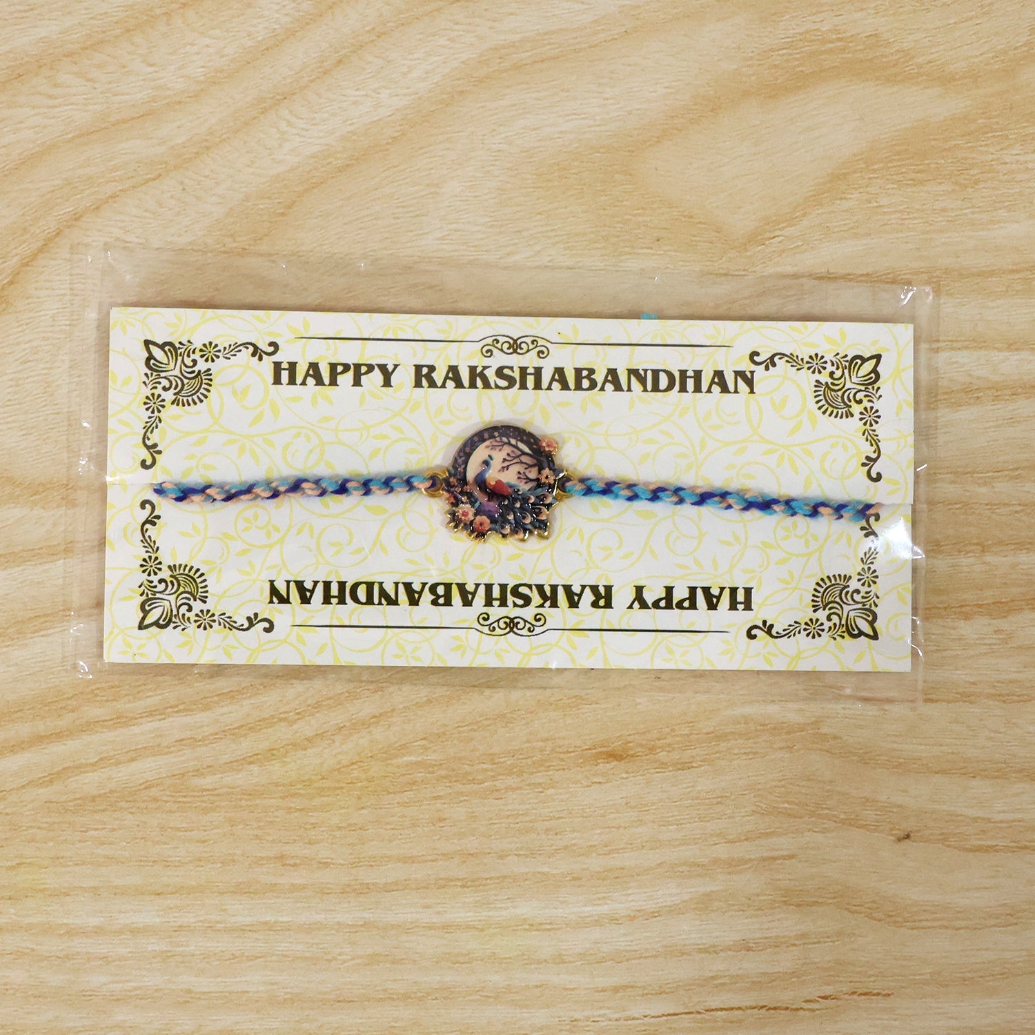 Close-up of charm and thread detail on Fancy Dori Rakhi for brother