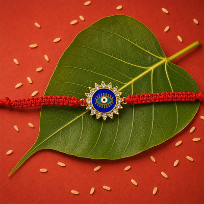 Traditional Blue Evil Eye Rakhi on a white surface