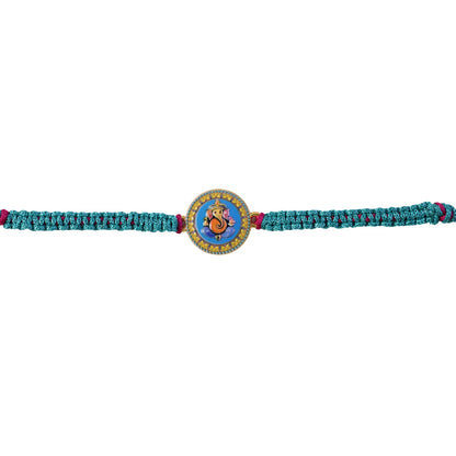 Ganesh Round Charm Fancy Dori Rakhi showing thread details