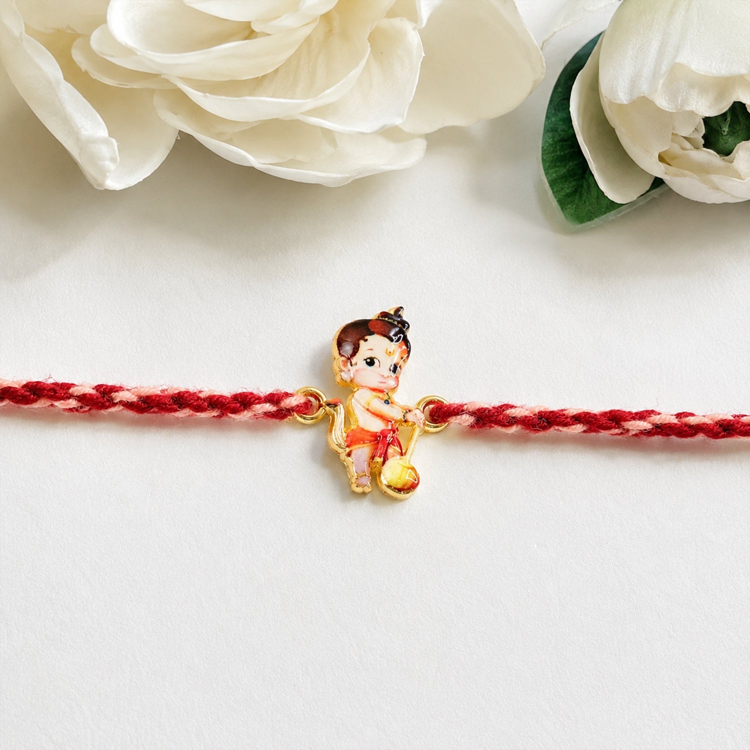 Close-up of Cute Bal Hanuman Fancy Dori Rakhi showing decorative details