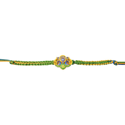 Green Om Peacock Fancy Dori Rakhi tied around wrist