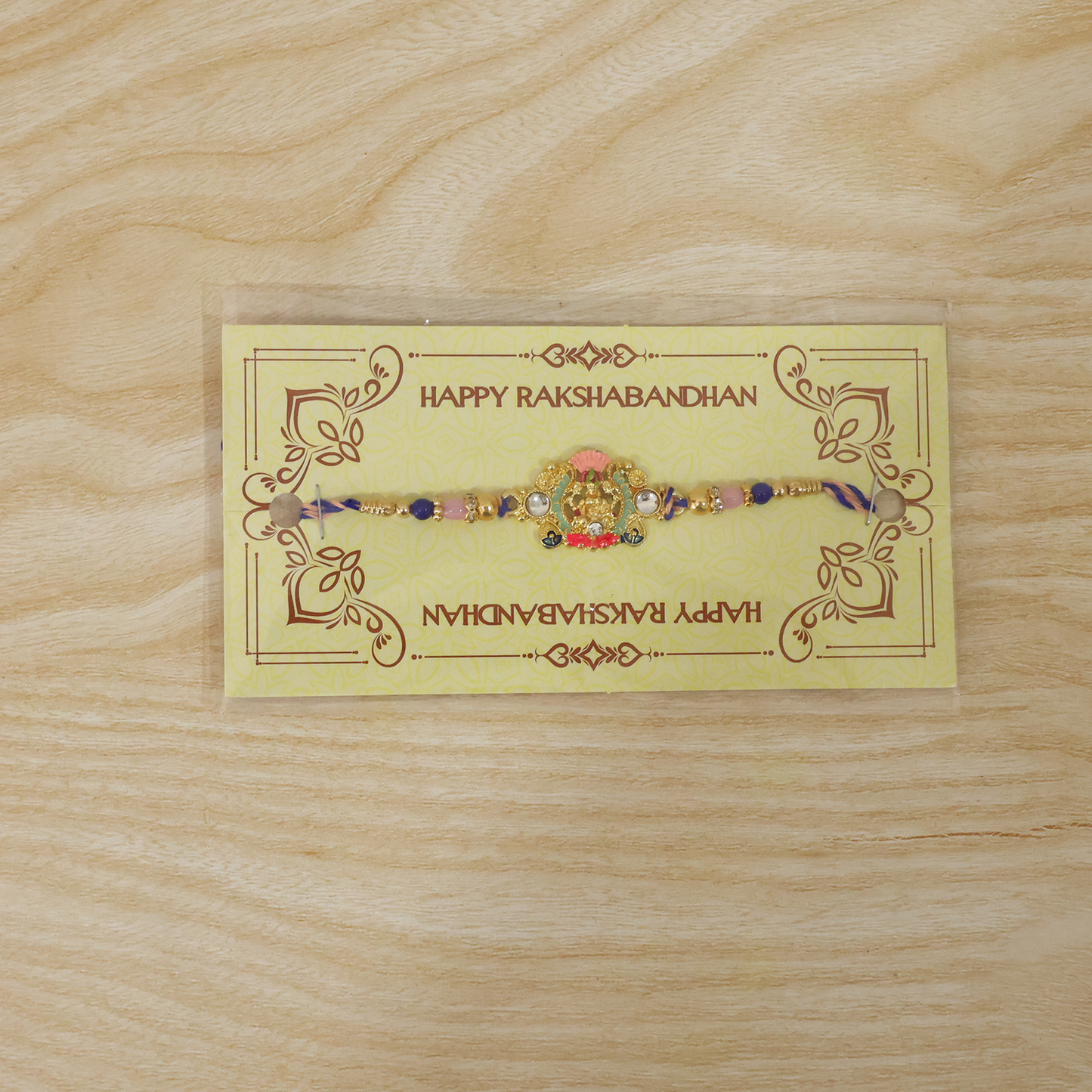 Rakhi with decorative beads and goddess charm