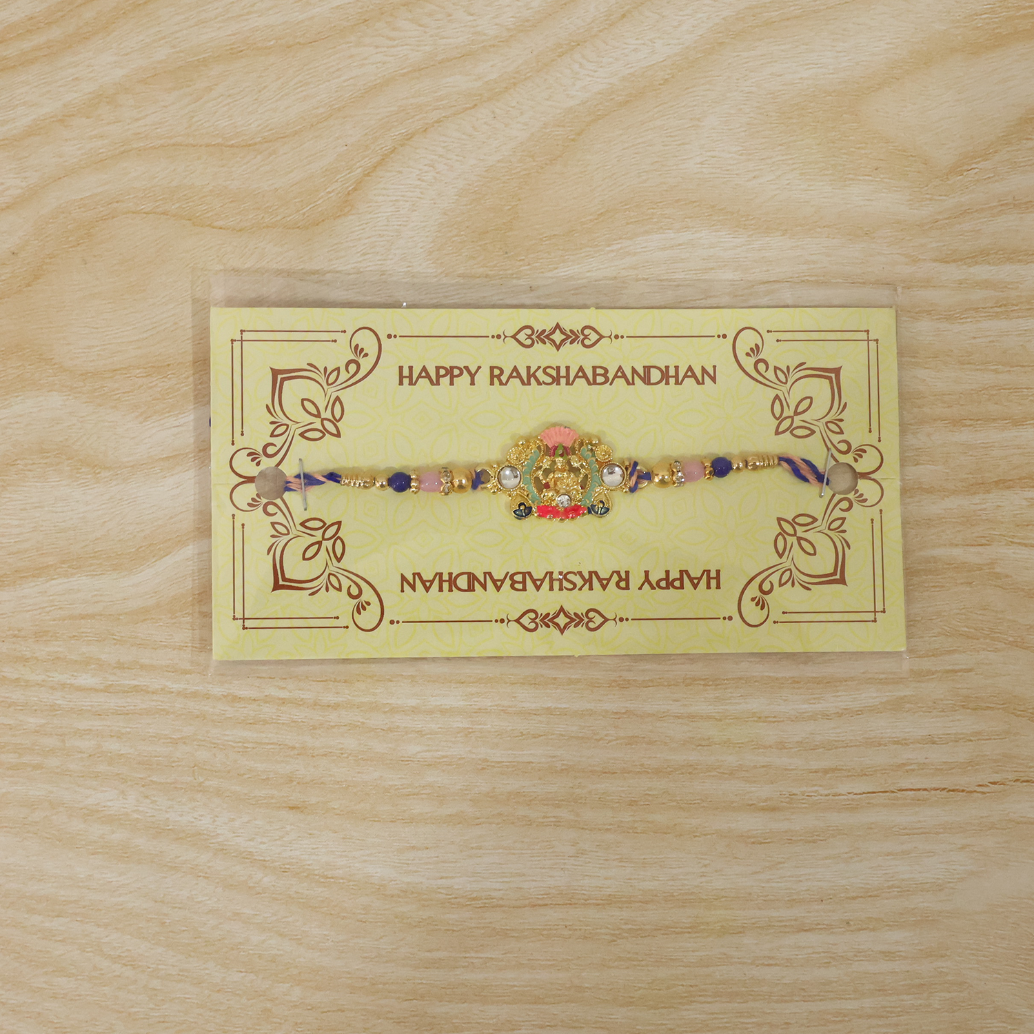 Rakhi with decorative beads and goddess charm