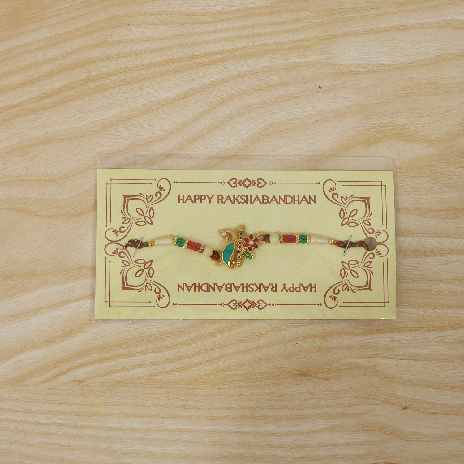 Peacock floral rakhi with beads tied on thread