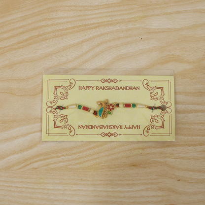 Peacock floral rakhi with beads tied on thread