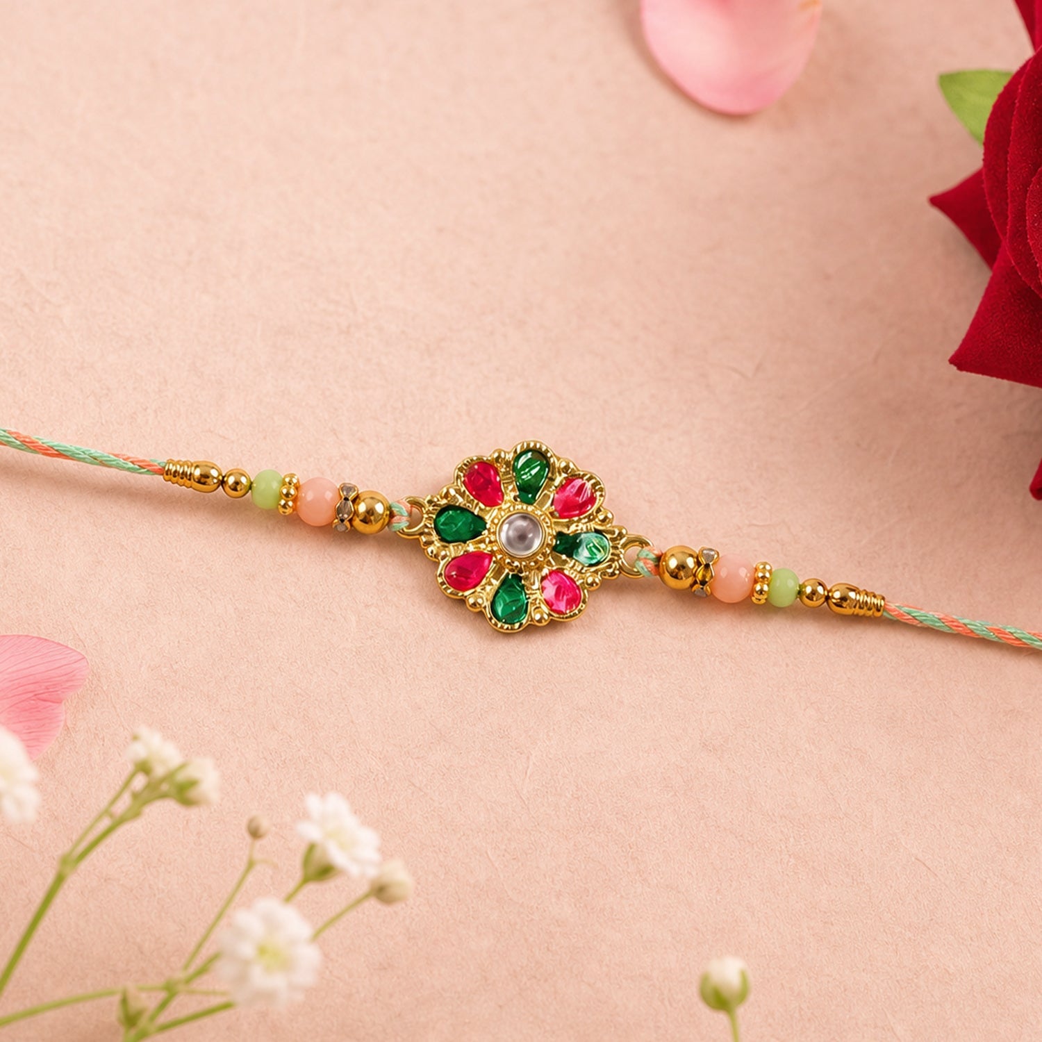 Elegant colorful flower rakhi tied on a thread for brother