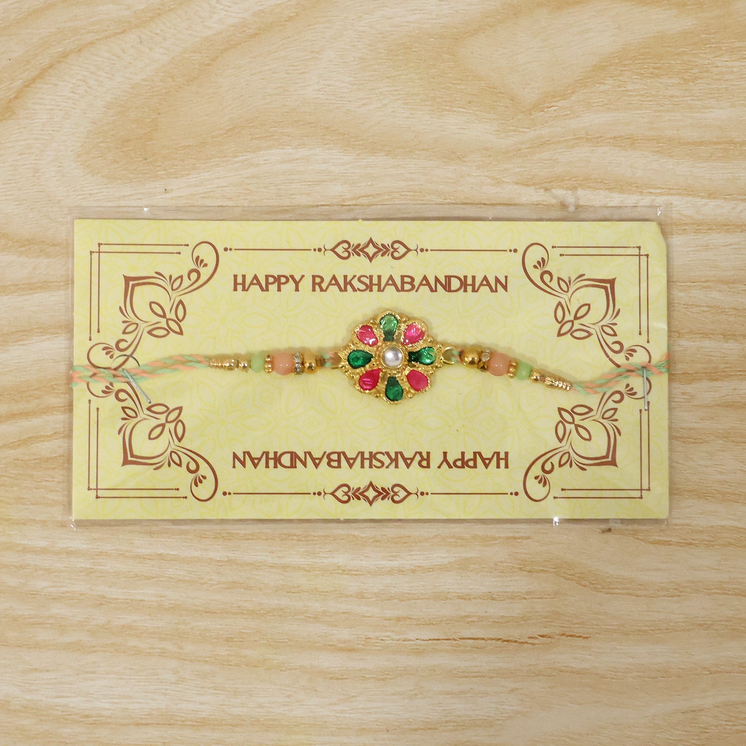 Bright and festive rakhi featuring colorful flower charm and beads