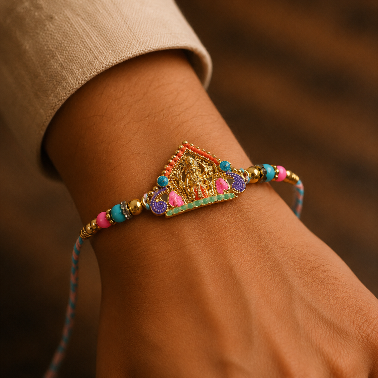 Close-up of Divine Idol Charm Rakhi for brother