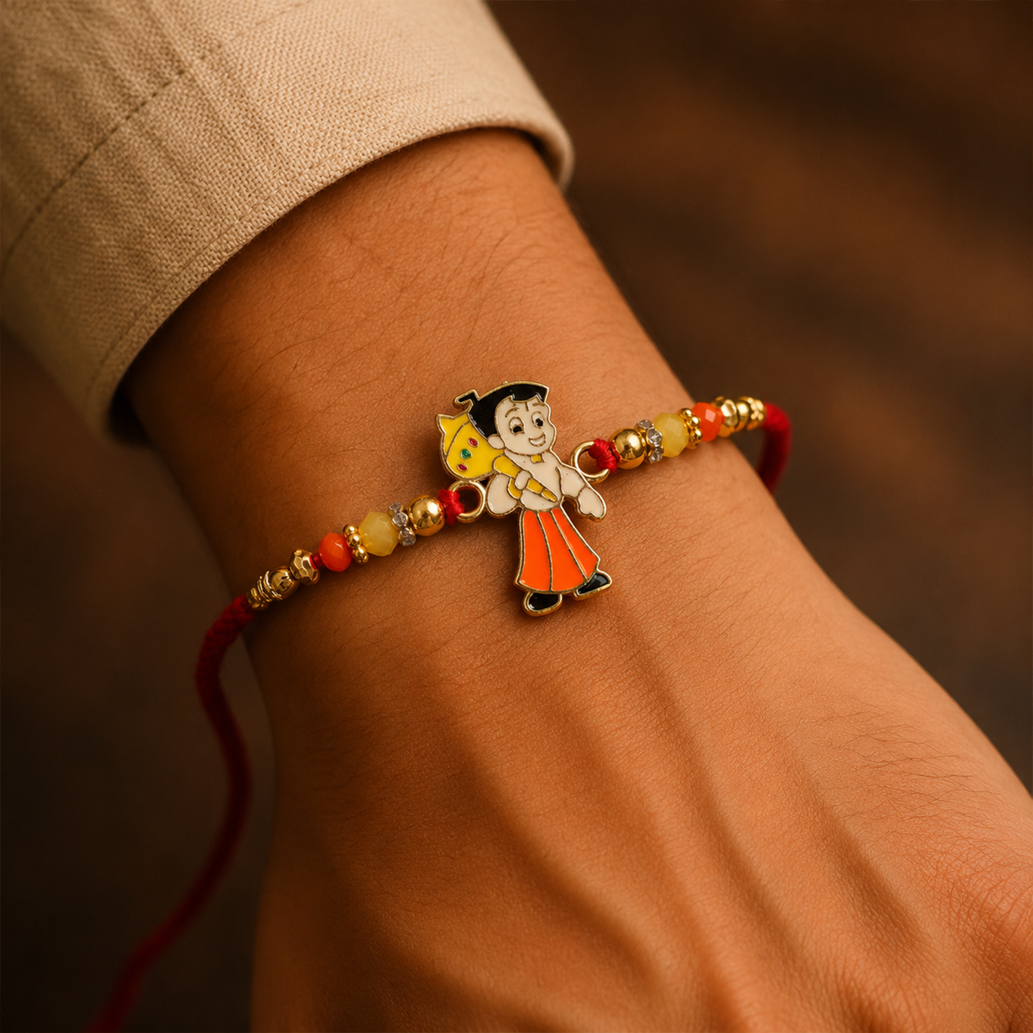 Designer rakhi featuring Chhota Bheem charm and beads