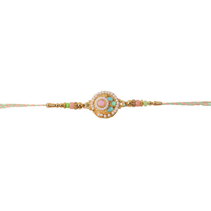 Side angle showing beads on pastel pearl rakhi
