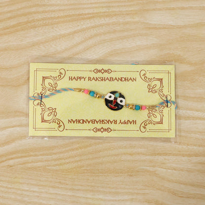 Festive rakhi featuring deity face charm with colorful beads