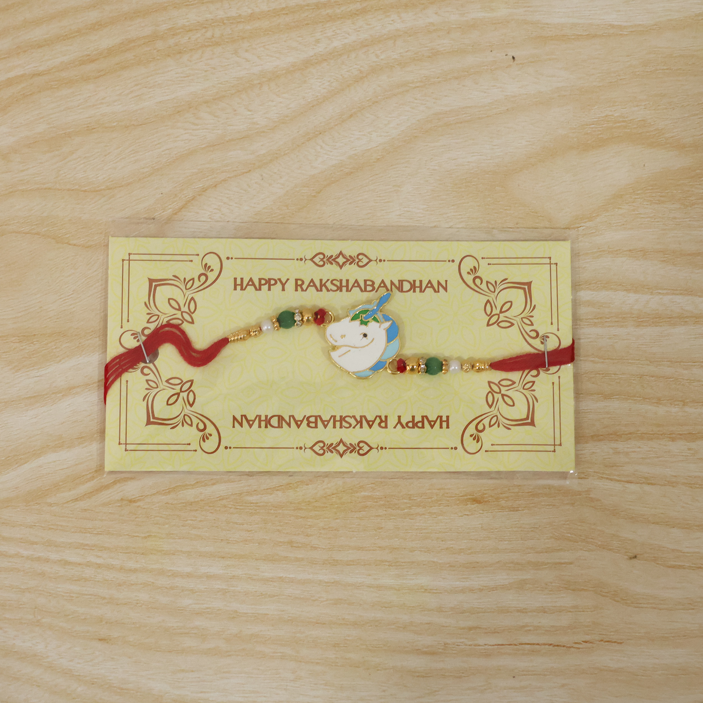 Unicorn Charm Rakhi with bright beads on festive style