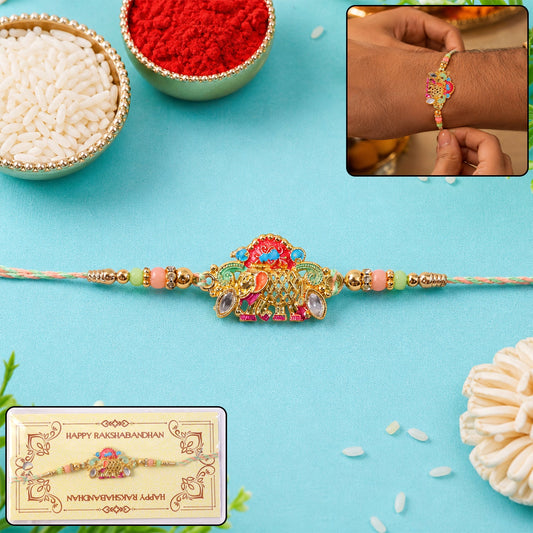 Close-up of elephant charm with beads on rakhi thread