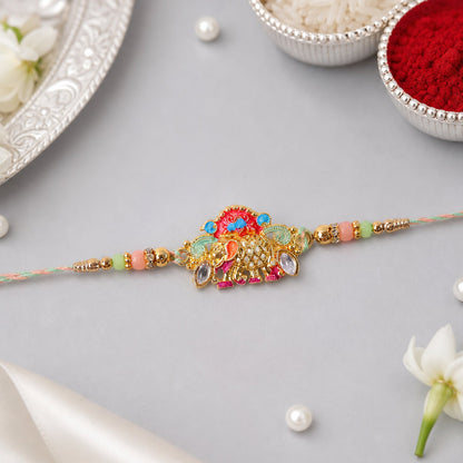 Designer rakhi showing colorful beads and elephant charm