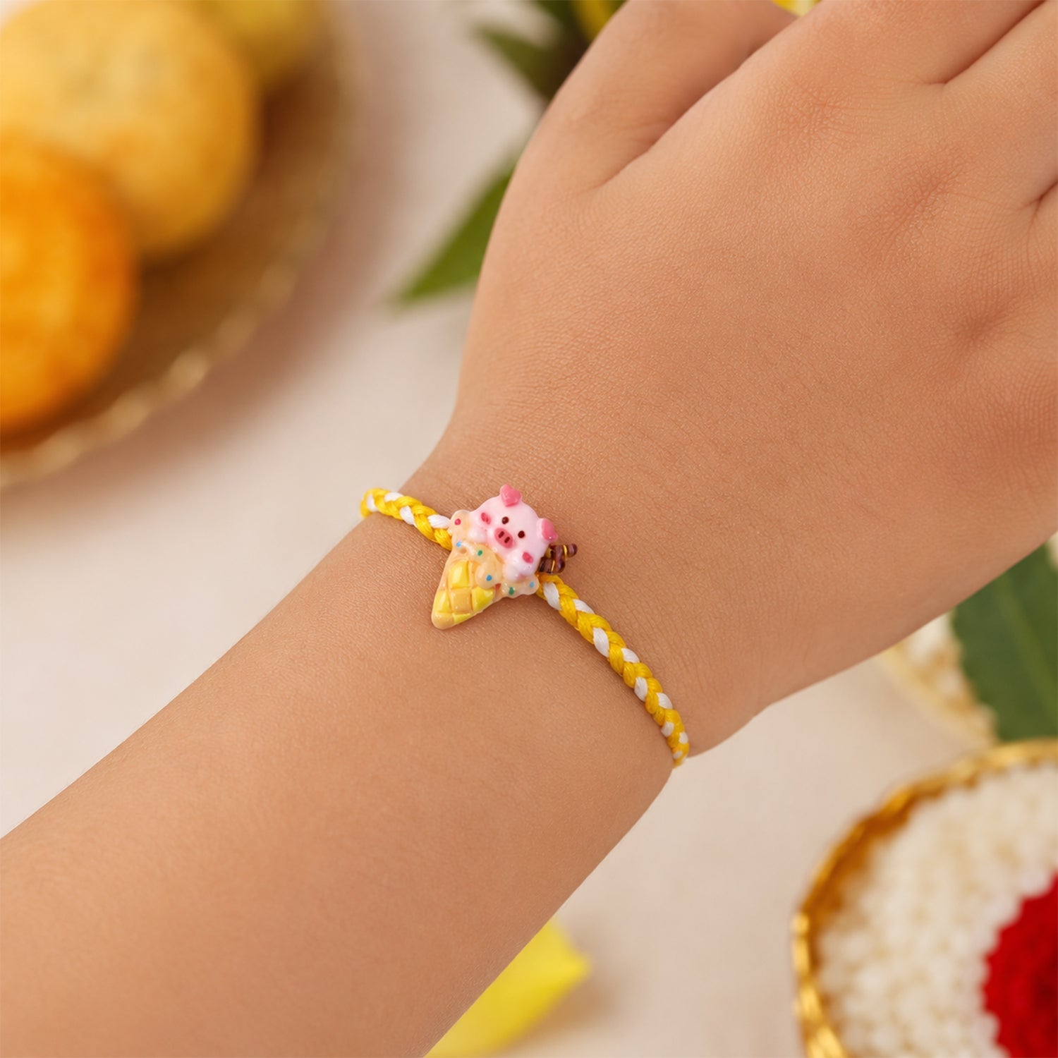 Side view of Cute Pig Ice Cream Fancy Dori Rakhi