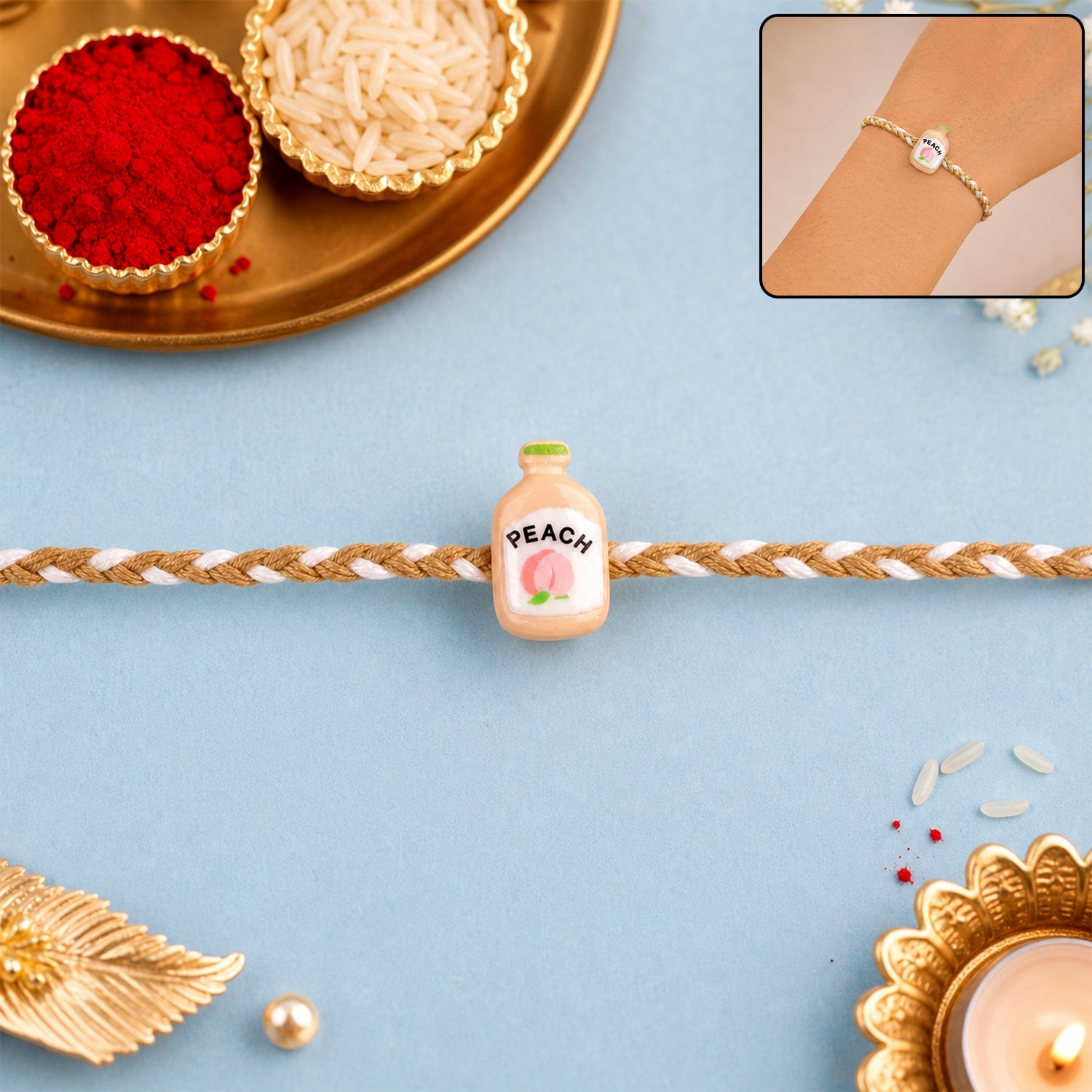 Peach Bottle Charm Fancy Dori Rakhi front view