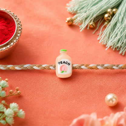 Peach Bottle Charm Rakhi with neat finishing