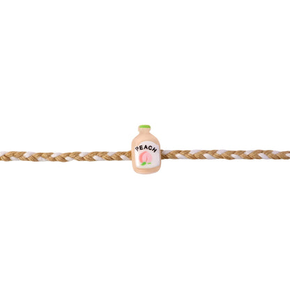Top view of Peach Bottle Charm Fancy Dori Rakhi