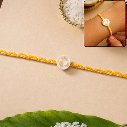 White Round Charm Fancy Dori Rakhi front view