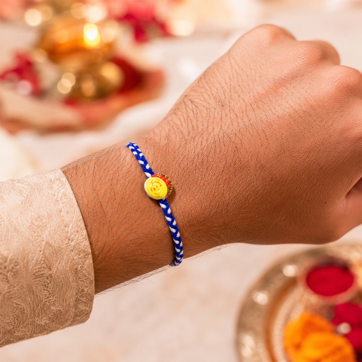 Detail view of Yellow Sweet Dessert Fancy Dori Rakhi