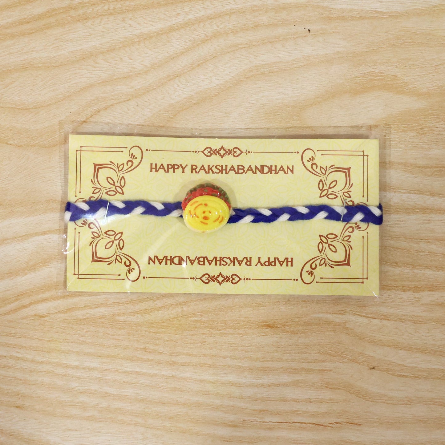 Yellow Sweet Dessert Fancy Dori Rakhi packaging view