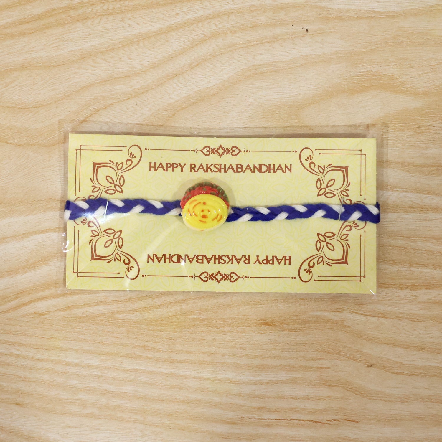 Yellow Sweet Dessert Fancy Dori Rakhi packaging view