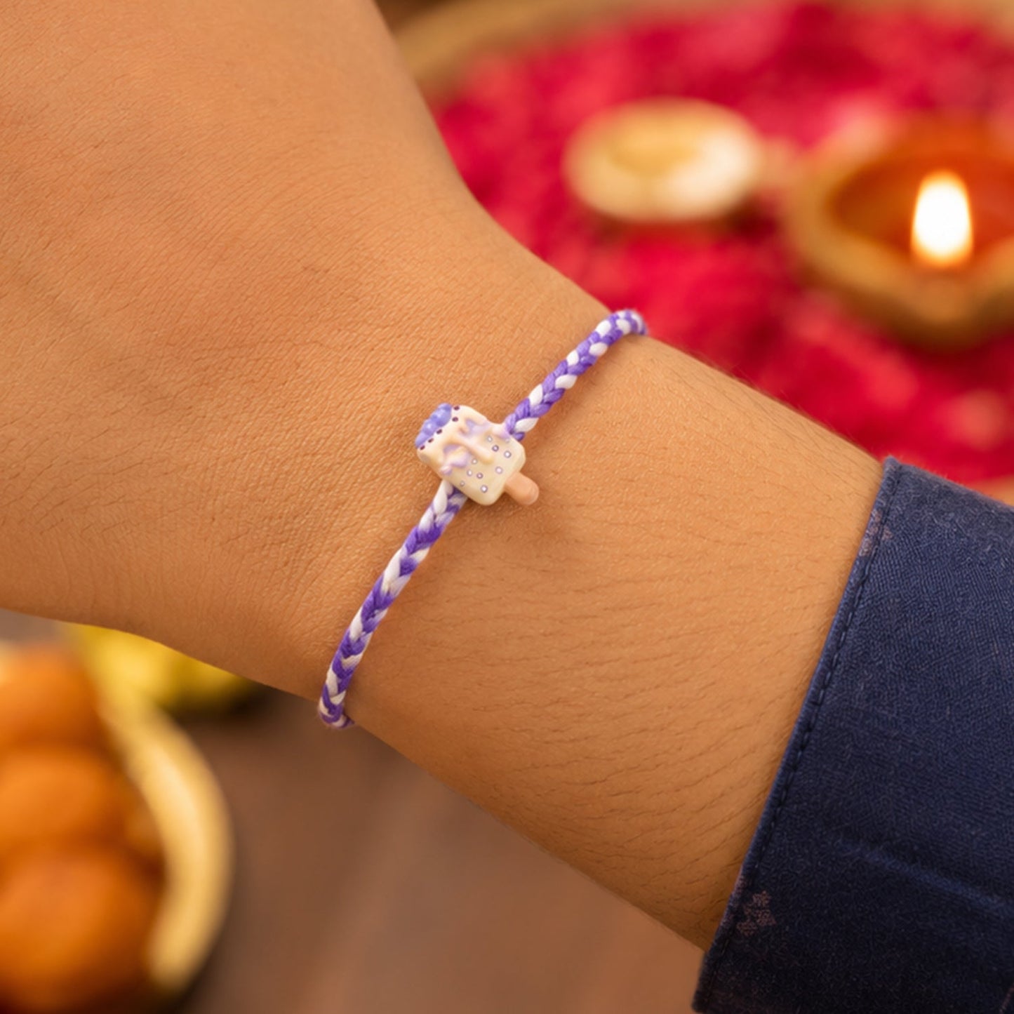 Designer rakhi showing festive dori detail
