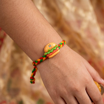 Side angle of Cute Burger Charm Fancy Dori Rakhi