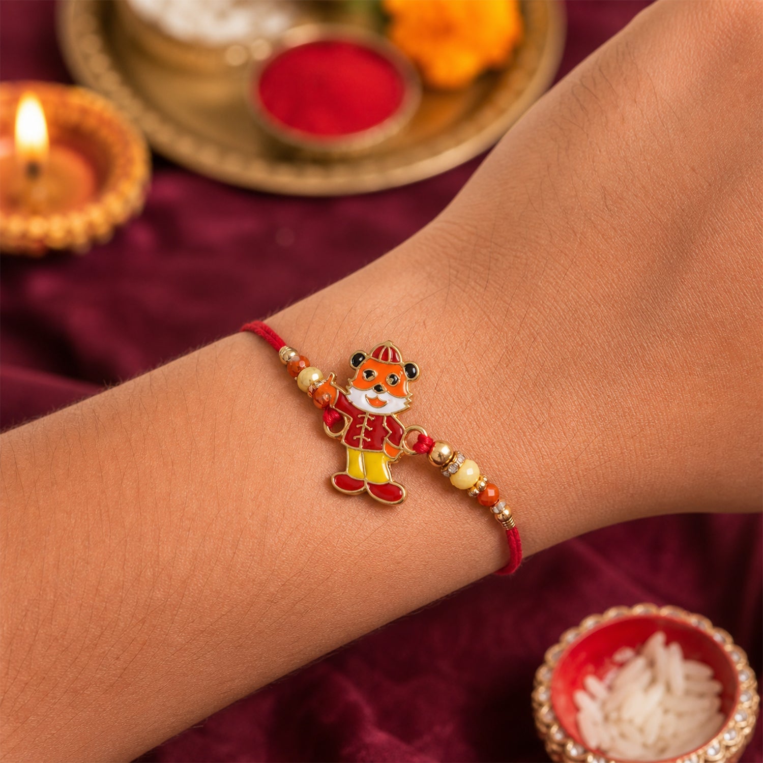 Close-up of cute charm rakhi with decorative beads and thread
