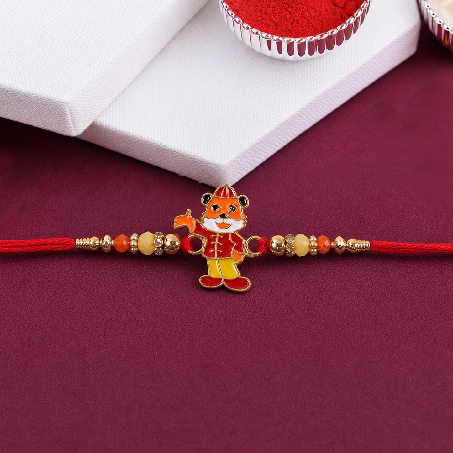 Side view of stylish rakhi showing neat finishing and charm detail