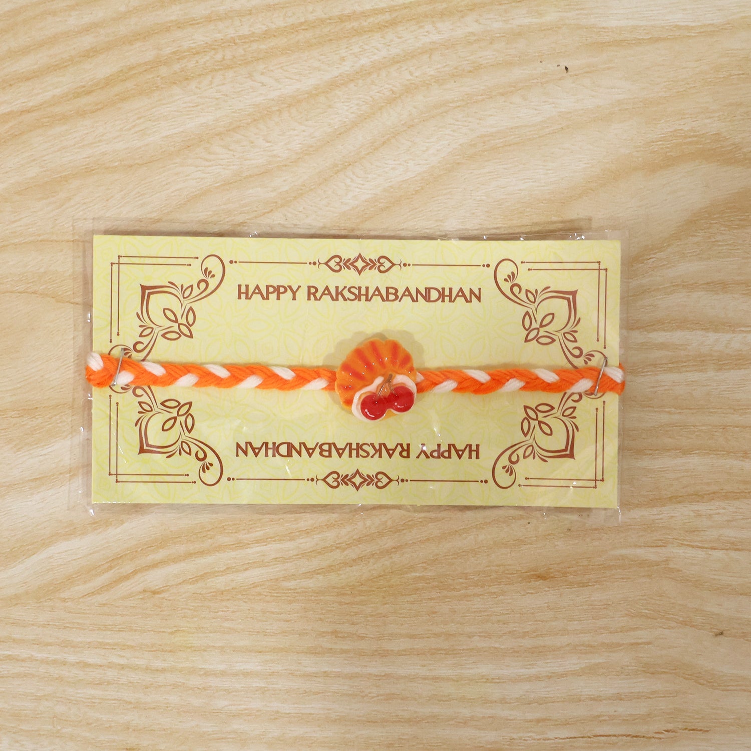 Detailed view of rakhi thread and charm