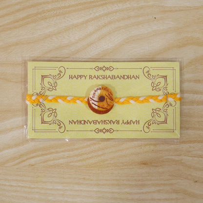 Side angle of donut charm dori rakhi
