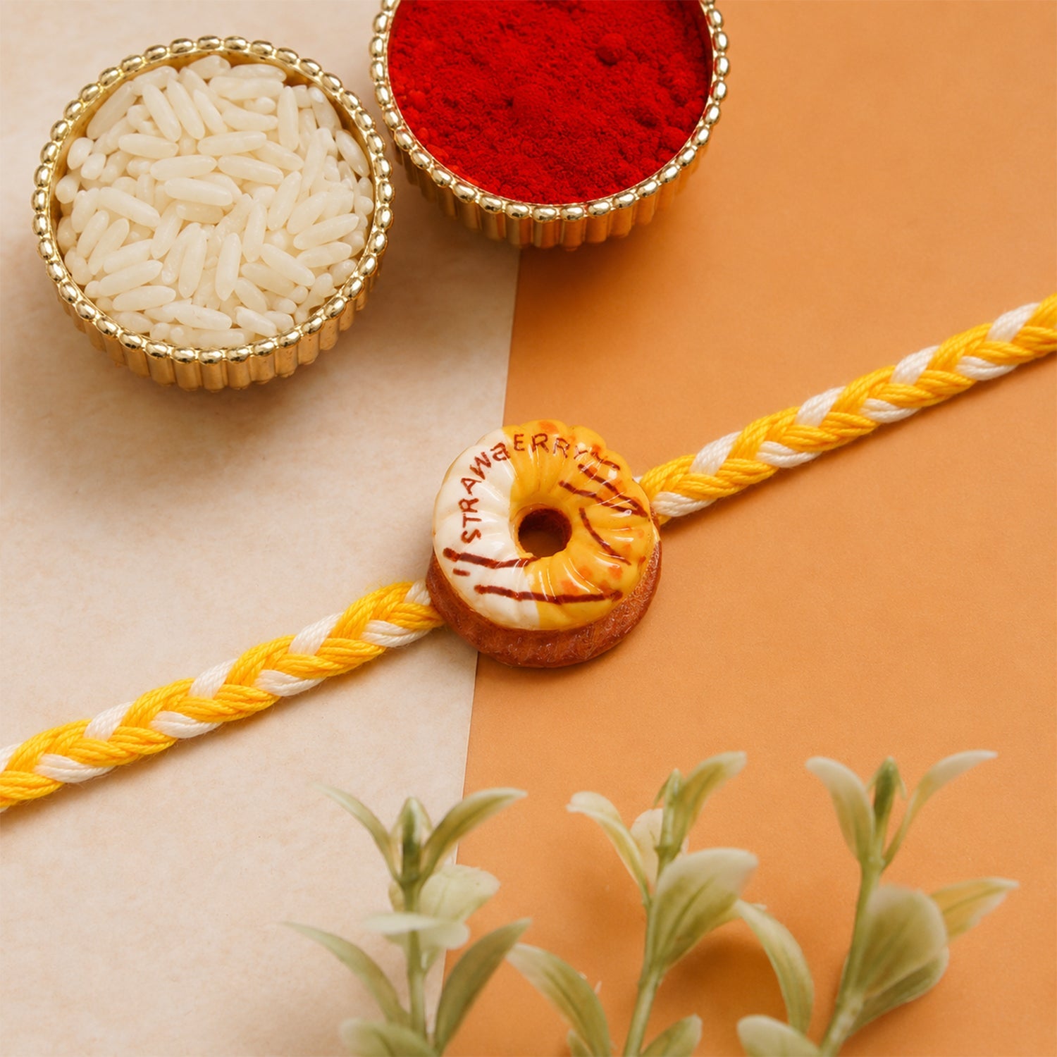 Donut charm rakhi styled on hand