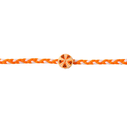 Orange Slice Designer Rakhi tied on wrist