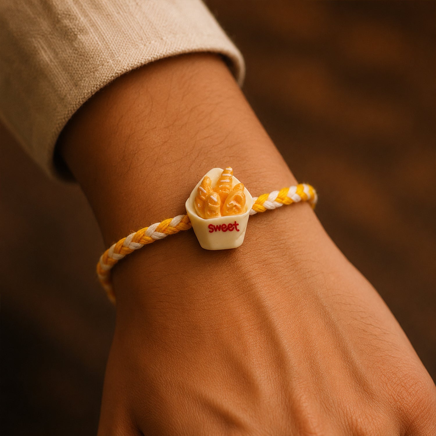 Close up of Sweet Fries Cup Fancy Dori Rakhi design