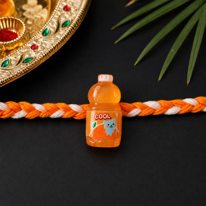 Close-up of fancy drink bottle charm rakhi showing detailed design