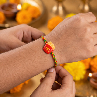 Close-up of French Fries Charm Fancy Dori Rakhi for Brother