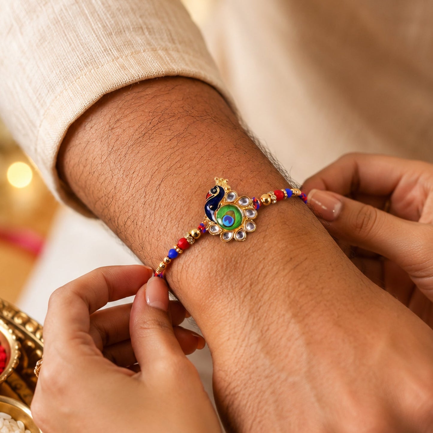 Side view of Peacock Feather Charm Rakhi showing bead details