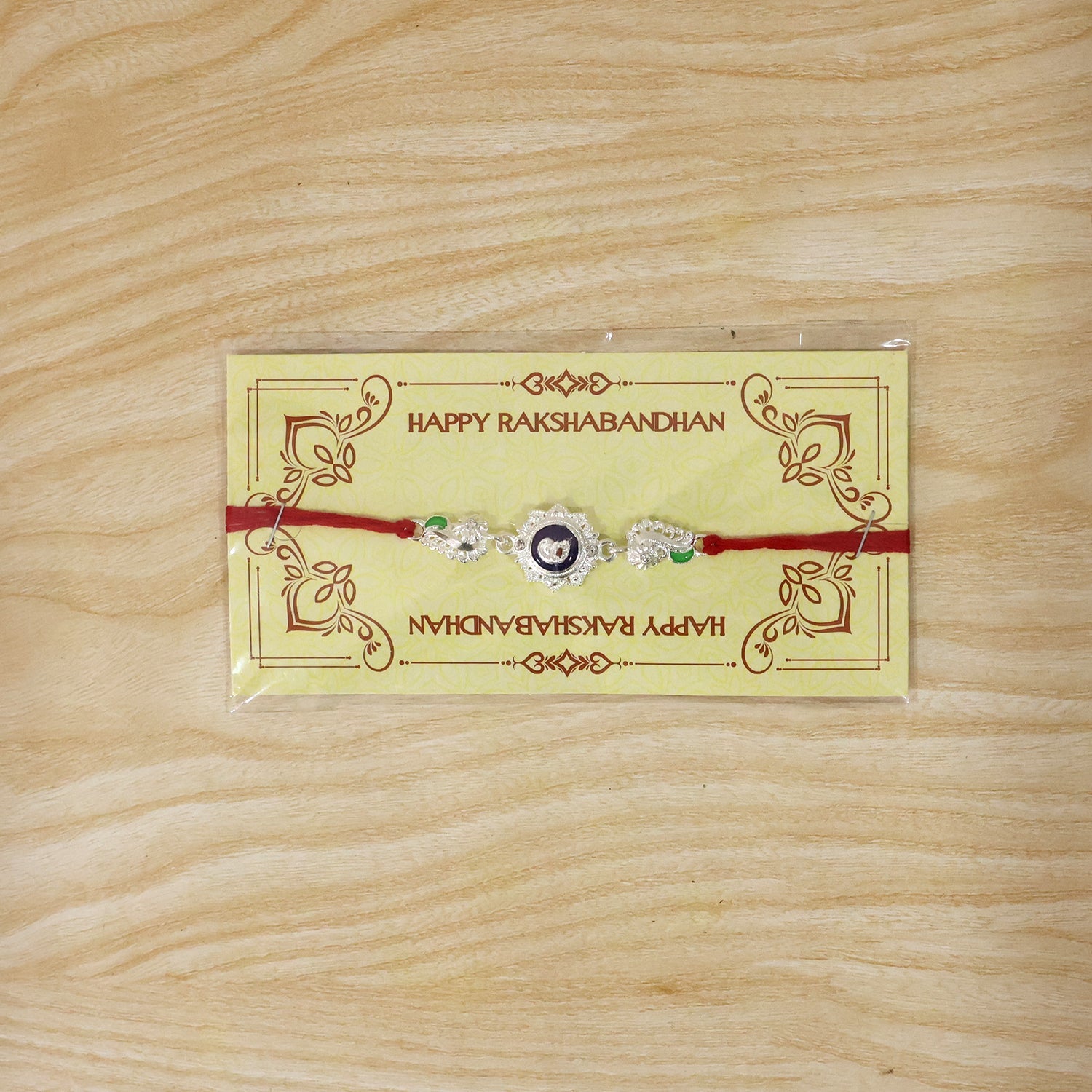 Silver round charm rakhi for Raksha Bandhan
