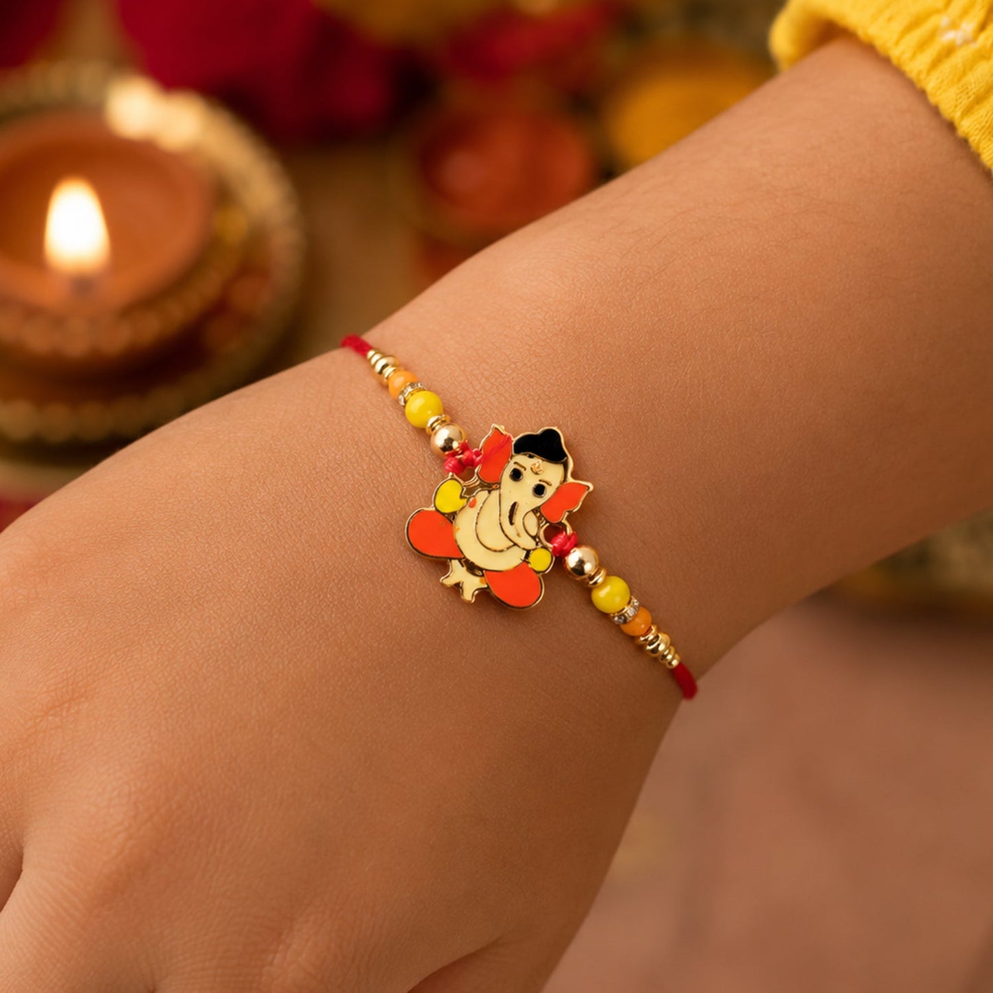 Close-up of designer rakhi featuring Divine Idol and beads